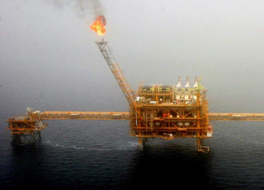 Gas flares from an oil production platform at the Soroush oilfields in the Persian Gulf, south of Iran, July 25, 2005.