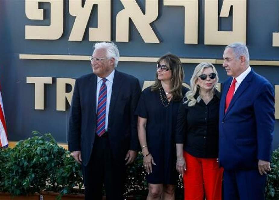 (L to R) US ambassador to Israel David Friedman, his wife Tami, Sara Netanyahu, and her husband Israeli Prime Minister Benjamin Netanyahu pose for a picture before the newly-unveiled sign for the new settlement of "Ramat Trump", or "Trump Heights" in English, named after the incumbent US President during an official ceremony in the Israeli-annexed Golan Heights on June 16, 2019. (AFP photos)