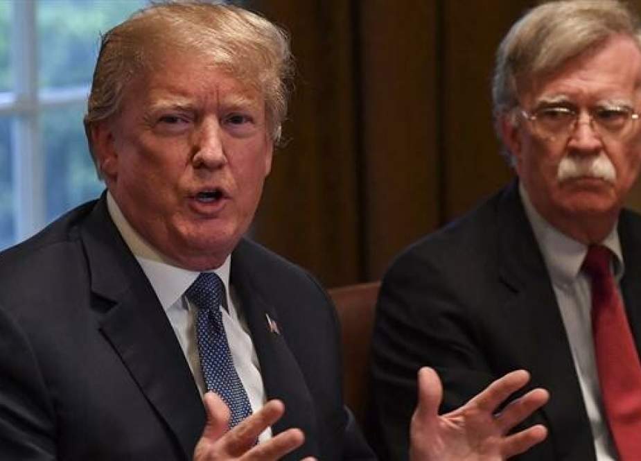 US National Security Adviser John Bolton (R) sits alongside US President Donald Trump