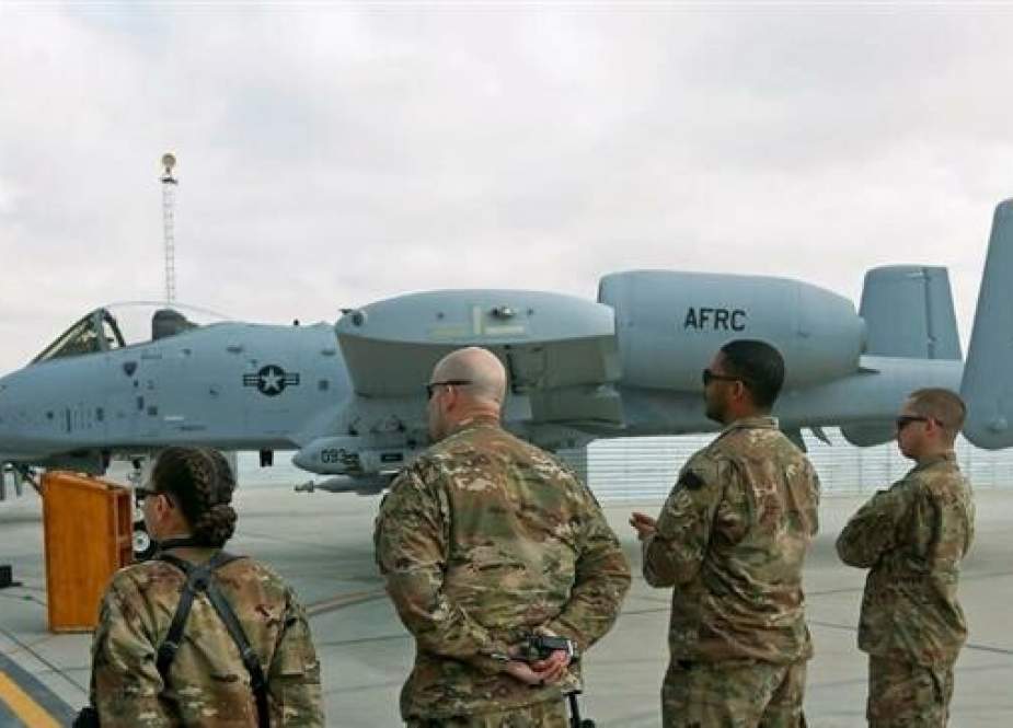 US air force personnel stand by an US A-10 aircraft.jpg