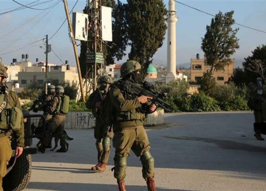 Israeli forces patrol a street in the northern West Bank village of Salem, east of Nablus, on March 18, 2019. (Photo by AFP)