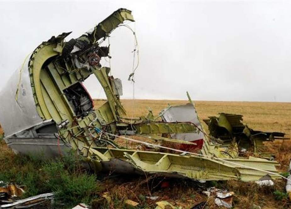 This file photo taken on September 09, 2014 shows a part of the Malaysia Airlines Flight MH17 at the crash site in the village of Hrabove (Grabovo), some 80km east of Donetsk. (Photo by AFP)