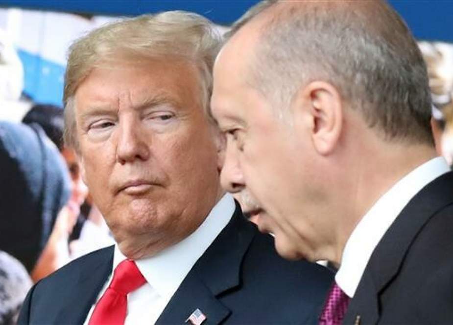 In this file picture taken on July 11, 2018, US President Donald Trump (L) talks to his Turkish counterpart Recep Tayyip Erdogan (R) as they arrive for the NATO summit, at the NATO headquarters in Brussels, Belgium. (Photo by AFP)
