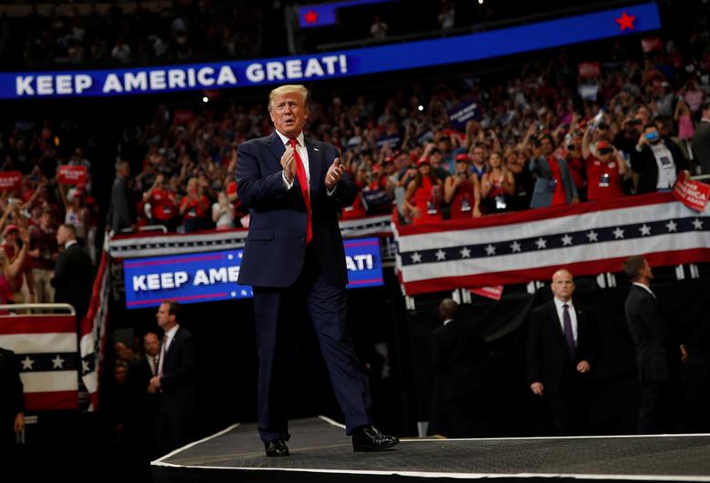 President Donald Trump reacts on stage formally kicking off his re-election bid with a campaign rally in Orlando, Florida, June 18, 2019