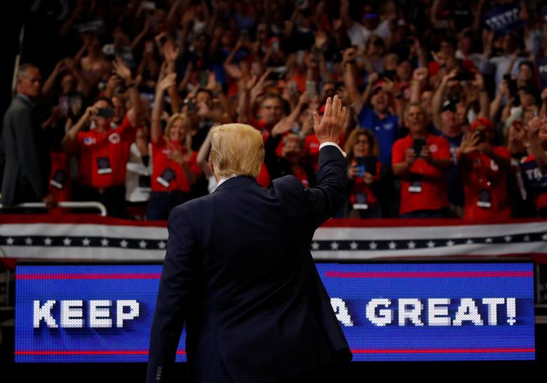 President Donald Trump reacts on stage formally kicking off his re-election bid with a campaign rally in Orlando
