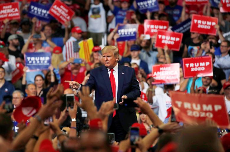 President Donald Trump reacts with supporters formally kicking off his re-election bid with a campaign rally in Orlando