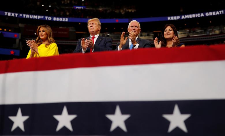 President Donald Trump reacts with first lady Melania Trump, Vice President Mike Pence and his wife Karen Pence on stage formally kicking off his re-election bid with a campaign rally in Orlando