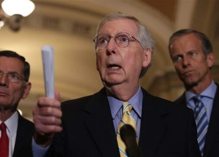 US Senate Majority Leader Mitch McConnell (R-KY) (C) speaks as Sen. John Barrasso (R-WY) (L) and Senate Majority Whip John Thune (R-SD) (R) listens during a news briefing after the weekly Senate Republican policy luncheon June 11, 2019 at the US Capitol in Washington, DC. (Photo by AFP)