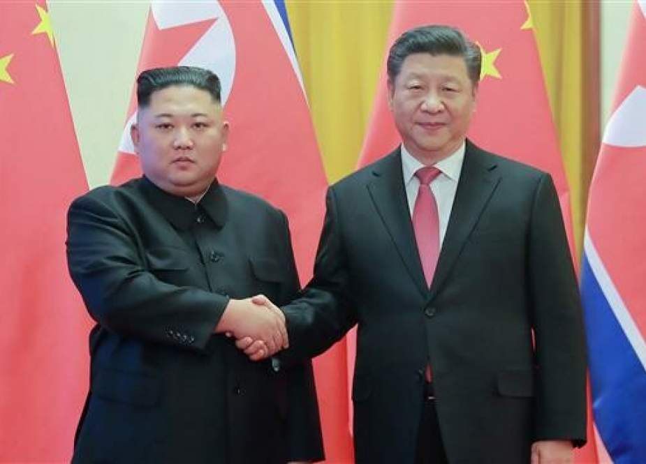 This file photo, taken on January 8, 2019 and released by North Korea’s official Korean Central News Agency (KCNA) on January 10, shows North Korea’s visiting leader Kim Jong-un (L) shaking hands with China’s President Xi Jinping (R) during a welcoming ceremony at the Great Hall of the People in Beijing. (Via AFP)