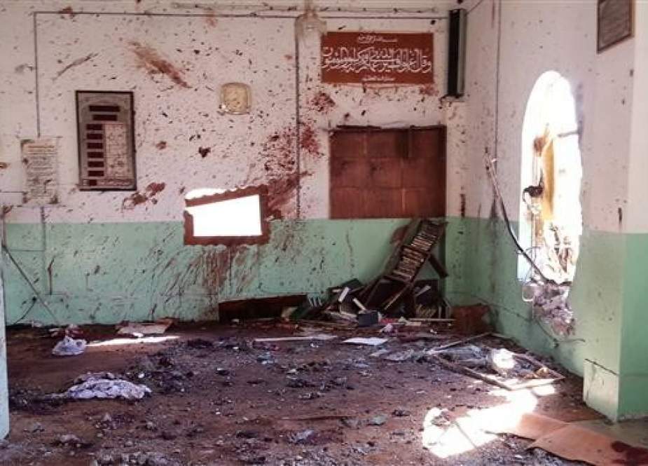 The file photo shows blood stains and debris strewn inside a mosque after a bomber struck during Friday prayers in the village of Umm al-Adham in Diyala province, Iraq. (Photo by the Associated Press)