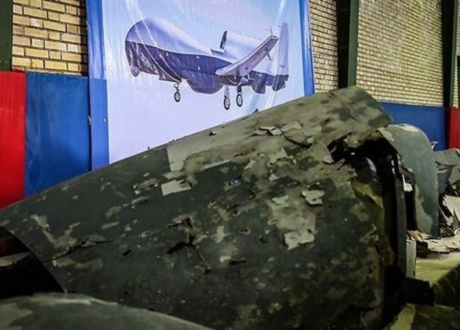 The photo taken on June 21, 2019 shows the wreckage of a US spy drone shot down by Iran’s Islamic Revolution Guards Corps (IRGC) the previous day. (By Tasnim news agency)