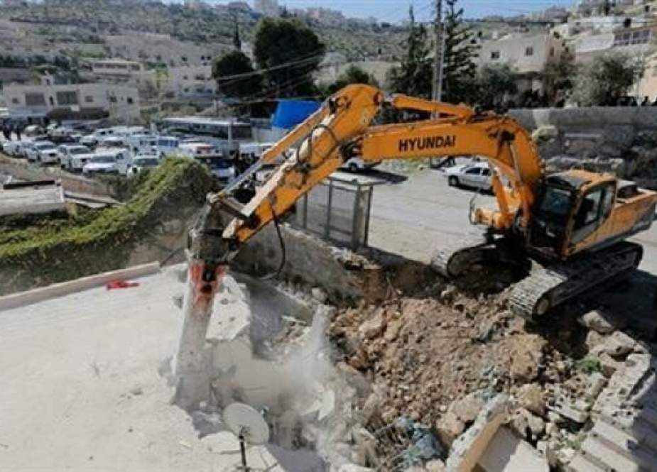 Israeli bulldozer is seen demolishing a Palestinian house in Jabel Mukaber in southern East Jerusalem al-Quds.jpg