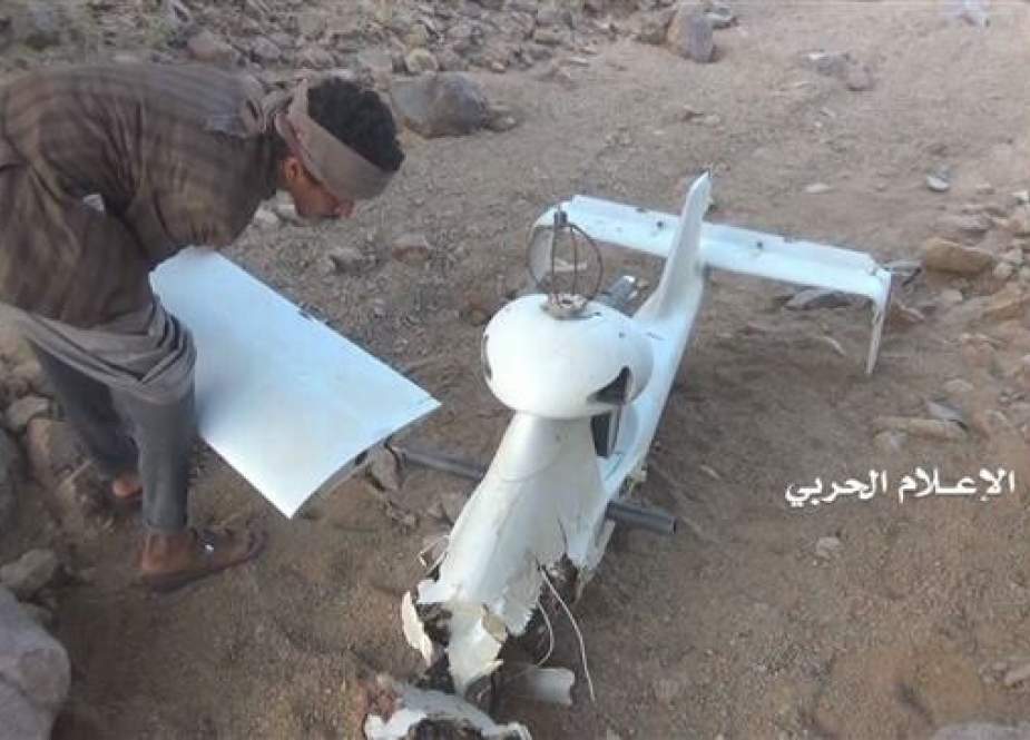 The undated photo shows the wreckage of an unmanned aerial vehicle belonging to the Saudi-led military coalition after it was intercepted and targeted by Yemeni army forces and allied fighters from Popular Committees. (Photo by the media bureau of Yemen’s Operations Command Center)