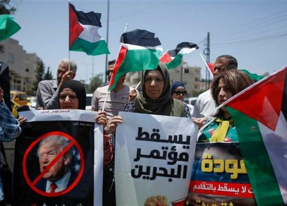 Palestinians hold banners and shout slogans as they rally against a US-sponsored conference scheduled for next week in Bahrain, in Bethlehem, in the occupied West Bank, on June 20, 2019. (Photo by AFP)