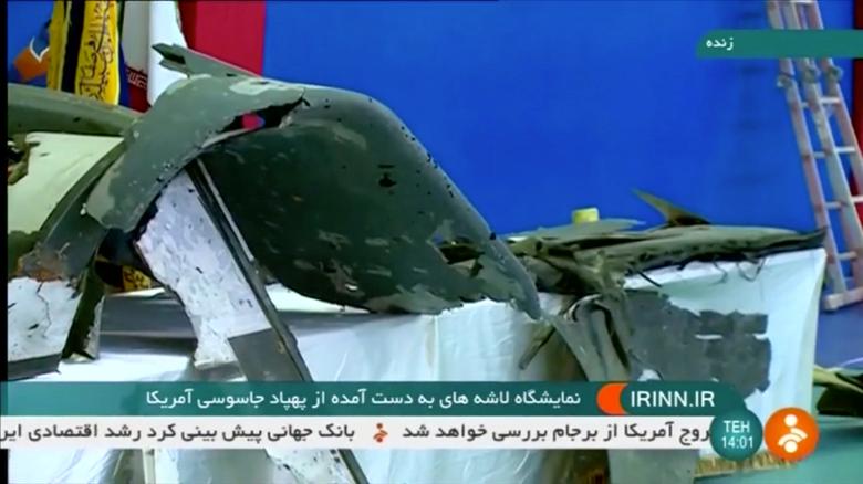 The purported retrieved sections of a downed U.S. drone are shown on Iranian state television in an unidentified location, June 21