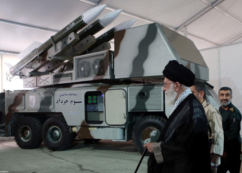 Iran's Supreme Leader Ayatollah Ali Khamenei is seen near a 
