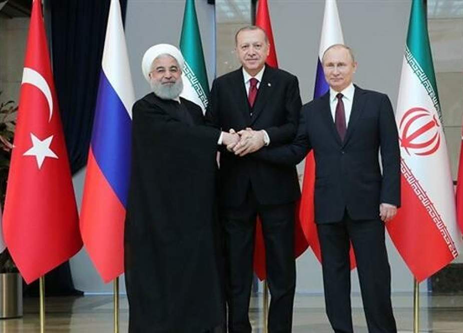 Russian President Vladimir Putin (R), Turkish President Recep Tayyip Erdogan (C) and Iranian President Hassan Rouhani.jpg