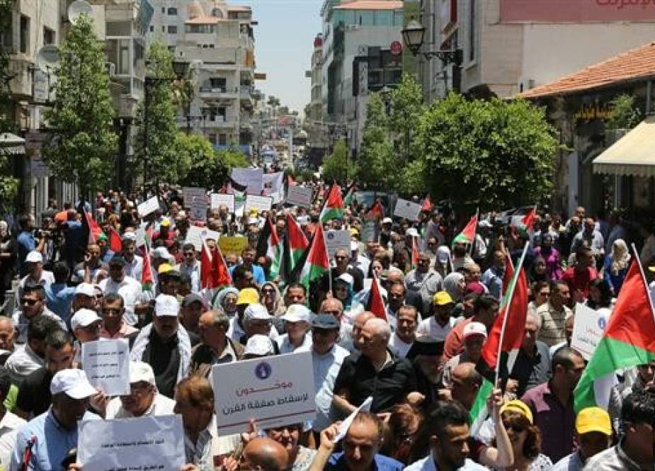 Palestinian protesters rally in the city of Qalqilyah in the occupied West Bank.jpg