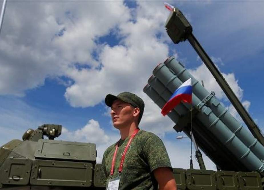 A serviceman stands next to military hardware during the International military-technical forum Army 2019, at the Patriot Congress and Exhibition Center in Moscow Region, Russia, on June 25, 2019. (Photo by Reuters)