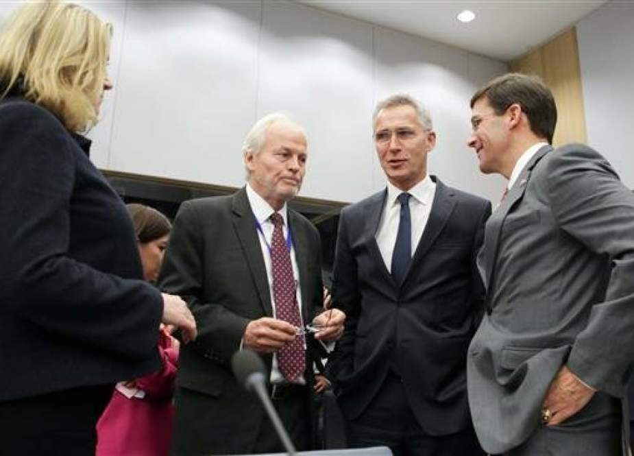 British Defense Secretary Penny Mordaunt (L), NATO Secretary General Jens Stoltenberg (C) and acting US Secretary for Defense Mark Esper (R).jpg
