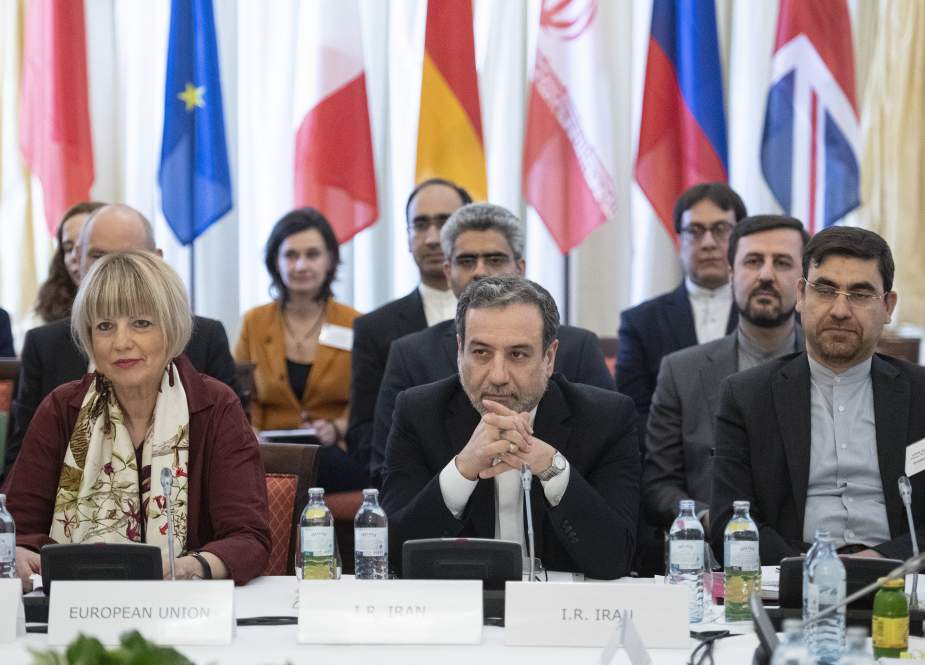 Iranian Deputy Foreign Minister Abbas Araghchi (R) and EU External Action Service Secretary General Helga Schmid (L) take part in a meeting of the Joint Commission of the Joint Comprehensive Plan of Action attended by the E3+2 (China, France, Germany, Russia, the United Kingdom) and Iran at the Palais Coburg in Vienna, Austria, on June 28, 2019. (Photo by AFP)