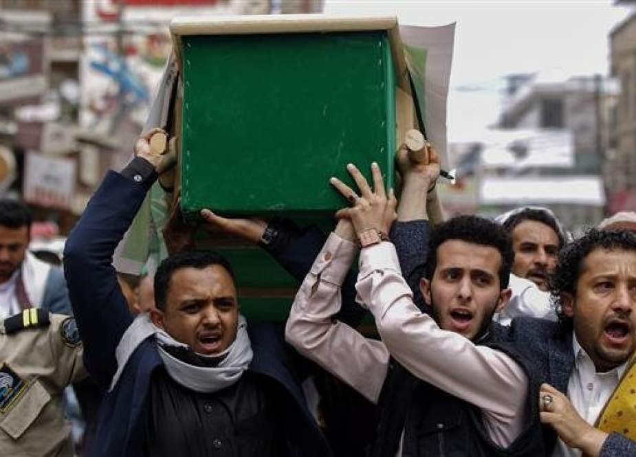 Mourners carry the coffins of the Yemenis killed in a Saudi airstrike, in the streets of the capital, Sana