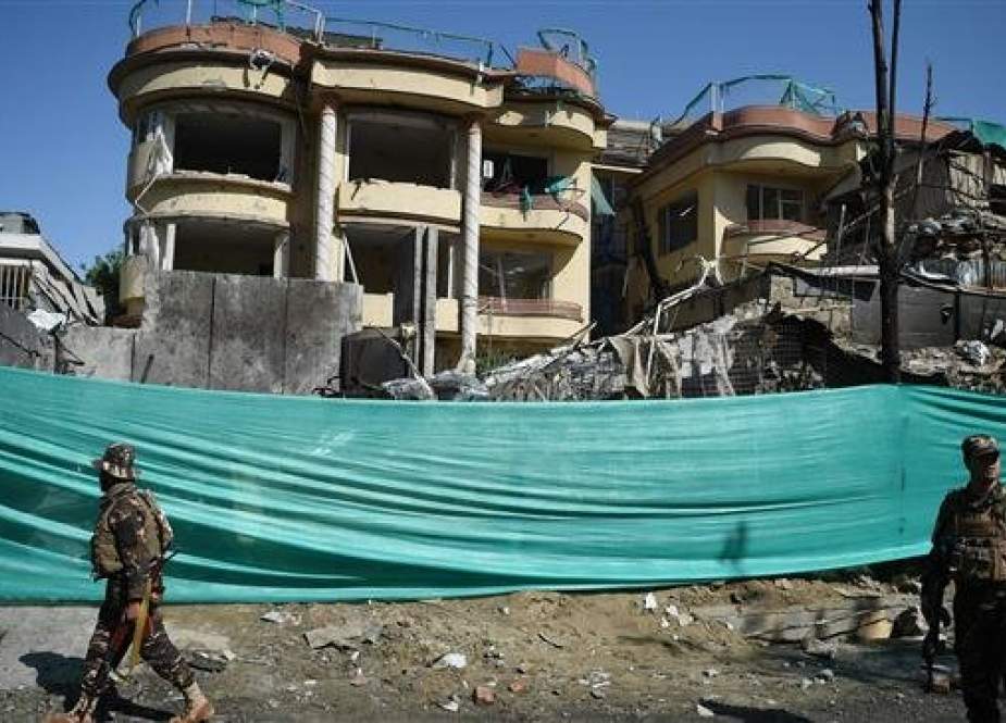 Afghan security forces standing at the site of a Taliban attack in Kabul