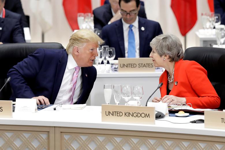 U.S. President Donald Trump, left, speaks to Britain's Prime Minister Theresa May prior to a working lunch at the G20 summit in Osaka, Japan, June 28