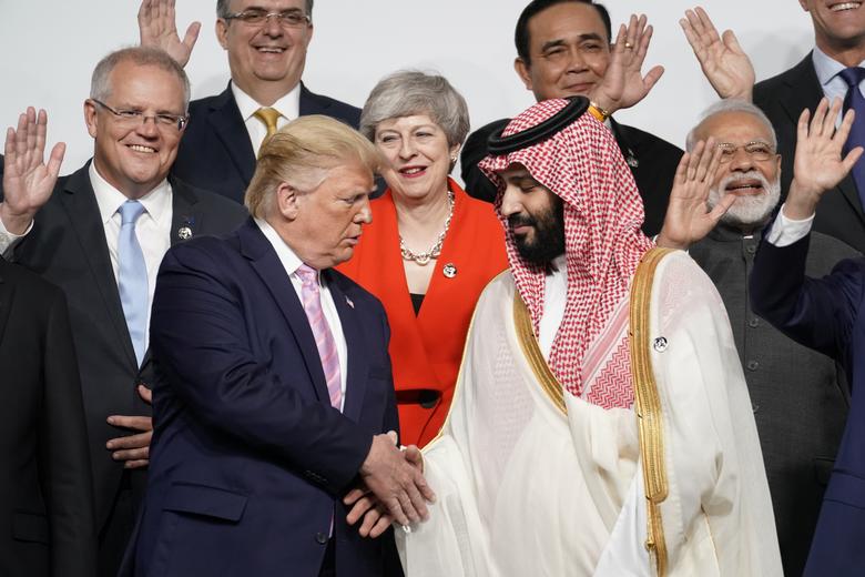 Saudi Arabia's Crown Prince Mohammed bin Salman shakes hands with U.S. President Donald Trump during a family photo session at the G20 leaders summit in Osaka, Japan, June 28