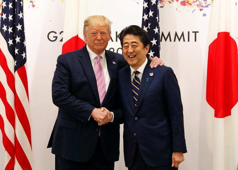 U.S. President Donald J. Trump and Japanese Prime Minister Shinzo Abe shake hands at the start of talks at the venue of the G20 Summit June 28