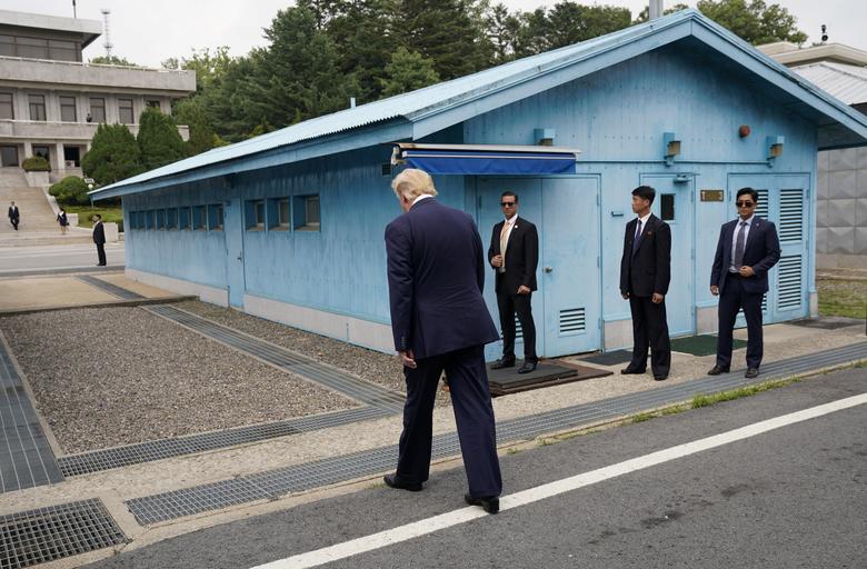 President Trump walks to meet with Kim Jong Un at the demilitarized zone separating the two Koreas, in Panmunjom, South Korea. Then, he walked slowly from the Freedom House on the South Korean side of the border village to meet the North Korean leader wh