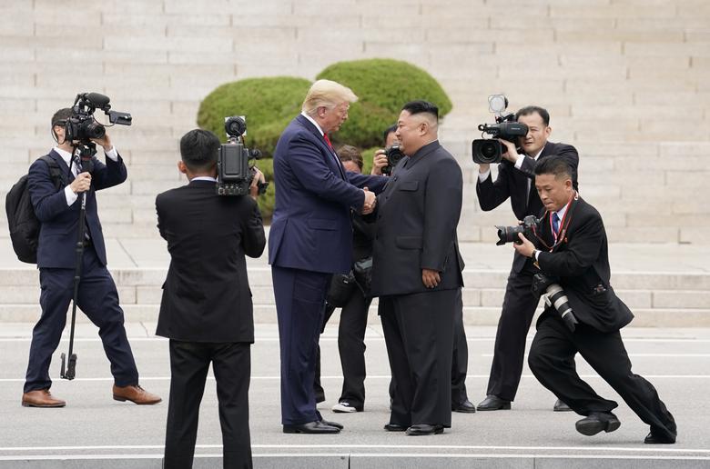 President Trump meets with Kim Jong Un at the demilitarized zone separating the two Koreas, in Panmunjom, South Korea. The chaotic scene of reporters and secret service bumping into each other highlighted how little planning had gone into the hastily arr
