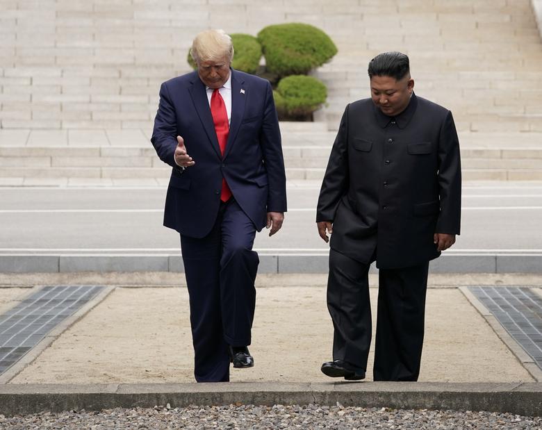 President Trump meets with Kim Jong Un at the demilitarized zone separating the two Koreas, in Panmunjom, South Korea. But the two leaders were oblivious to the confusion as they exchanged invitations to visit each others' capitals. 