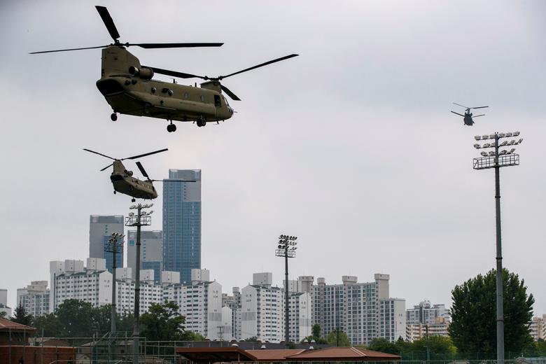 Support helicopters follow the Marine One helicopter carrying President Trump to the demilitarized zone (DMZ) as they take off from Seoul, South Korea
