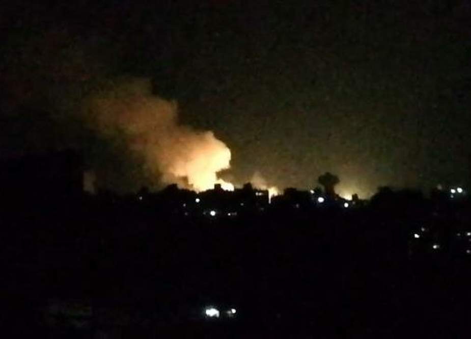 Smoke billowing over buildings near the Syrian capital Damascus following Israeli airstrike.jpg