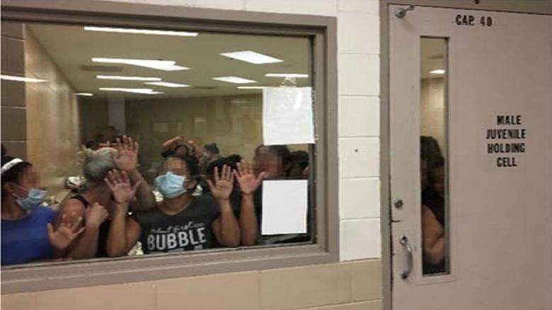Some of a group of 51 adult females press against the window of a cell built to hold 40 male juveniles at Fort Brown Border Patrol station in a still image from video in Brownsville, Texas, on June 12, 2019. Picture pixelated at source