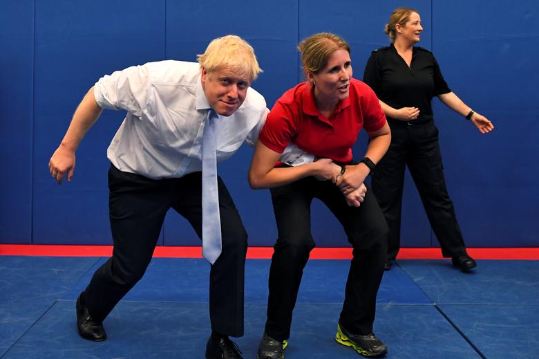 Boris Johnson, a leadership candidate for Britain's Conservative Party, reacts as he visits the Thames Valley Police Training Centre in Reading, Britain, July 3