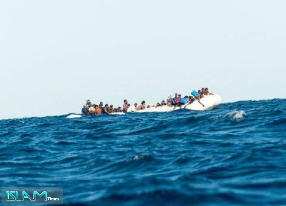 Numerous refugees from Libya are desperate to reach the Italian coast on a rubber dinghy in the Mediterranean Sea, Jan. 27 2018. They are awaiting the aid of SOS Mediterranee and the Italian coast watch. (Photo: Laurin Schmid/SOS Mediterranee/picture alliance via Getty Images)