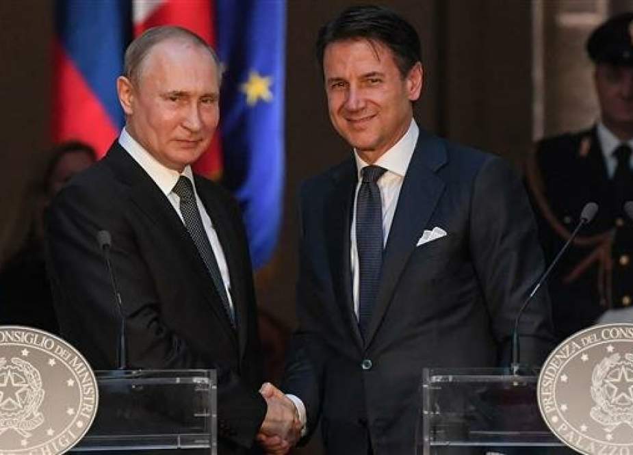Italian Prime Minister Giuseppe Conte (R) and Russian President Vladimir Putin shake hands after holding a joint press conference in Rome on July 4, 2019. (Photo by AFP)