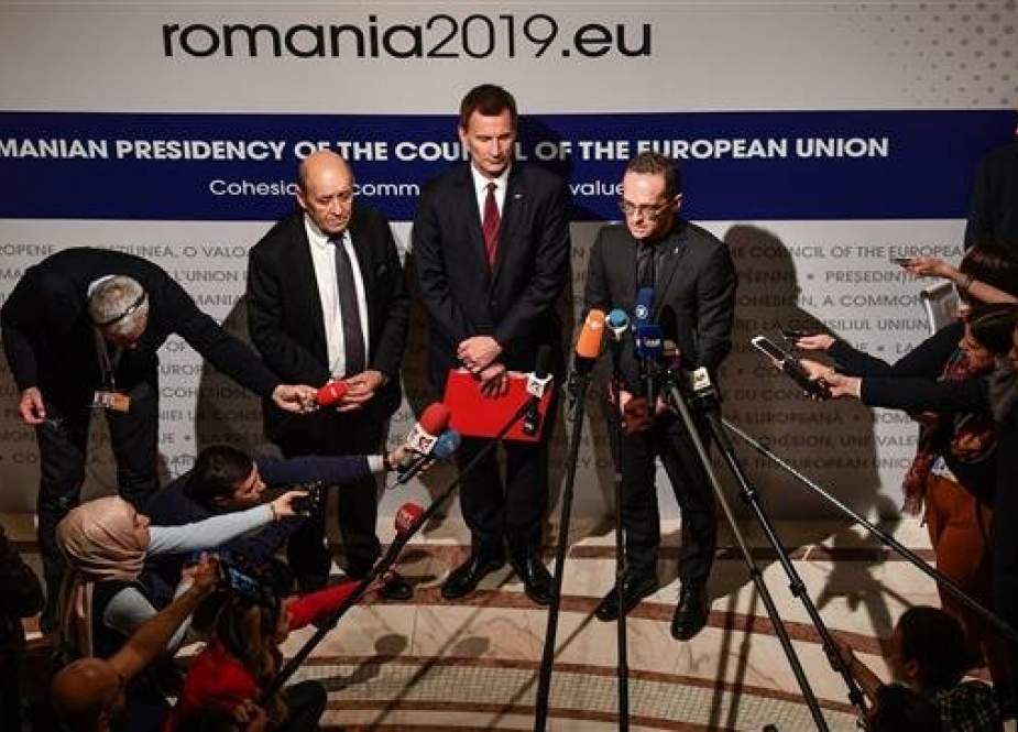French Foreign Minister Jean-Yves Drian (L), UK Foreign Secretary Jeremy Hunt (C) and German Foreign Minister Heiko Maas give a press conference on Iran at the informal meeting of the EU Foreign Ministers at the National Bank of Romania headquarters in Bucharest January 31, 2019. (Photo by AFP)