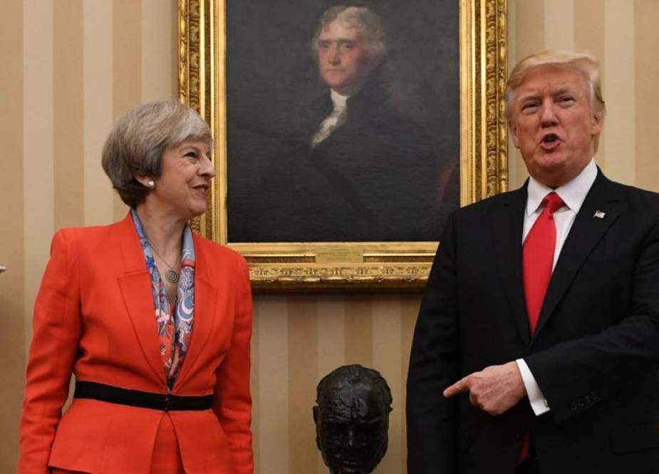 US President Donald Trump (L) speaks to Theresa May, Britain
