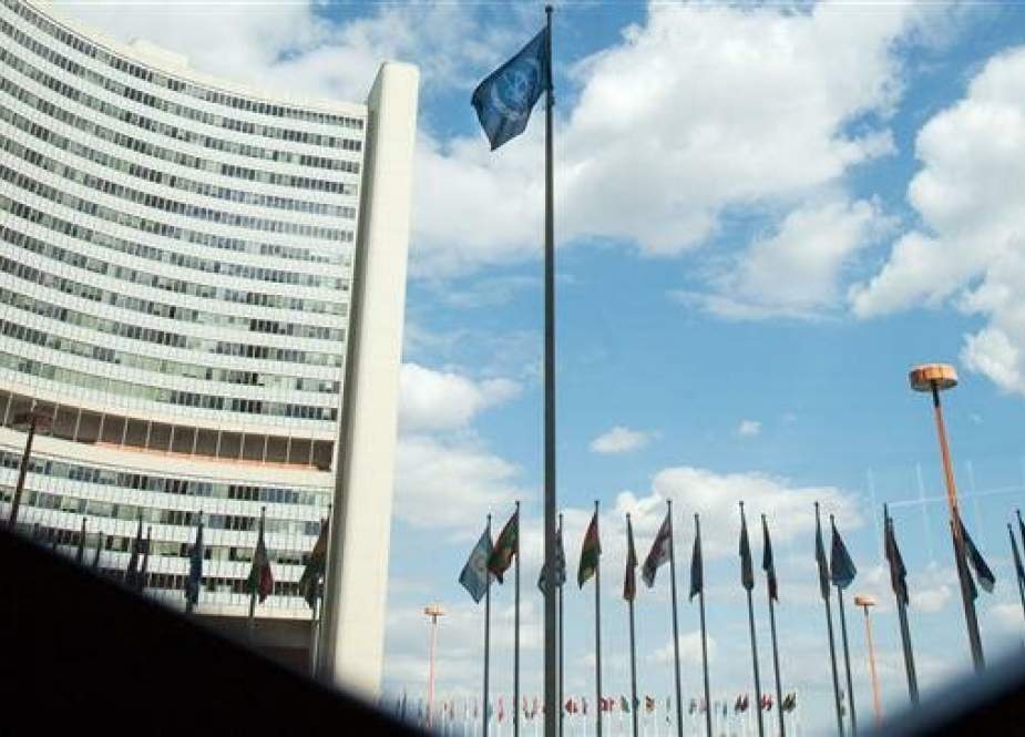Flag of the International Atomic Energy Agency (IAEA) flutters in front of the IAEA building in Vienna.jpg