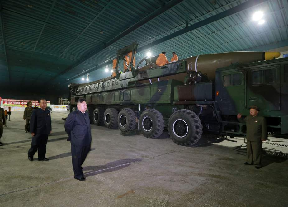 North Korean leader Kim Jong-un walks by a Hwasong-15 intercontinental ballistic missile (ICBM). (File photo)