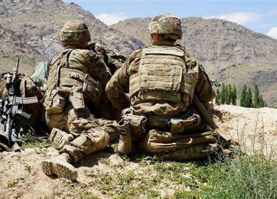 In this photo, taken on June 6, 2019, US soldiers are seen looking out over hillsides at a checkpoint in the Nerkh district of Wardak Province in Afghanistan. (By AFP)