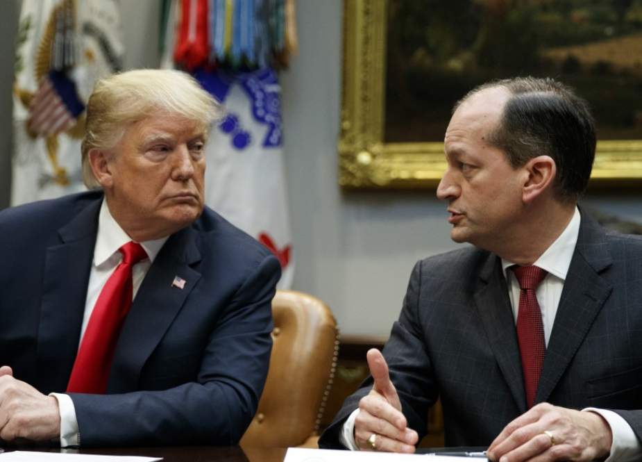US President Donald Trump (L) listens to US Labor Secretary Alexander Acosta during a media address early on July 12, 2019 at the White House in Washington, DC.