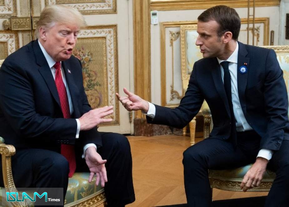 French President Emmanuel Macron speaks with US President Donald Trump.