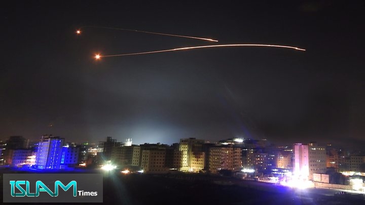 In this file picture, Syrian anti-aircraft missiles rise into the sky as Israeli missiles target positions in Damascus, Syria.