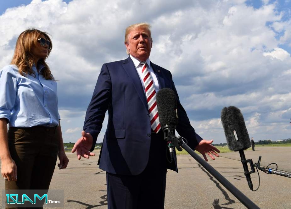 US President Donald Trump gives a statement about the recent mass shootings in El Paso and Dayton before boarding to Washington at Morristown Airport on August 04, 2019.