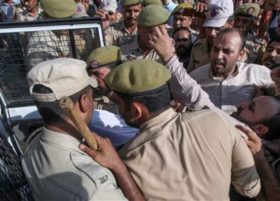 Police personnel detain activists of Jammu and Kashmir Youth Congress during a protest against the Indian government.jpg