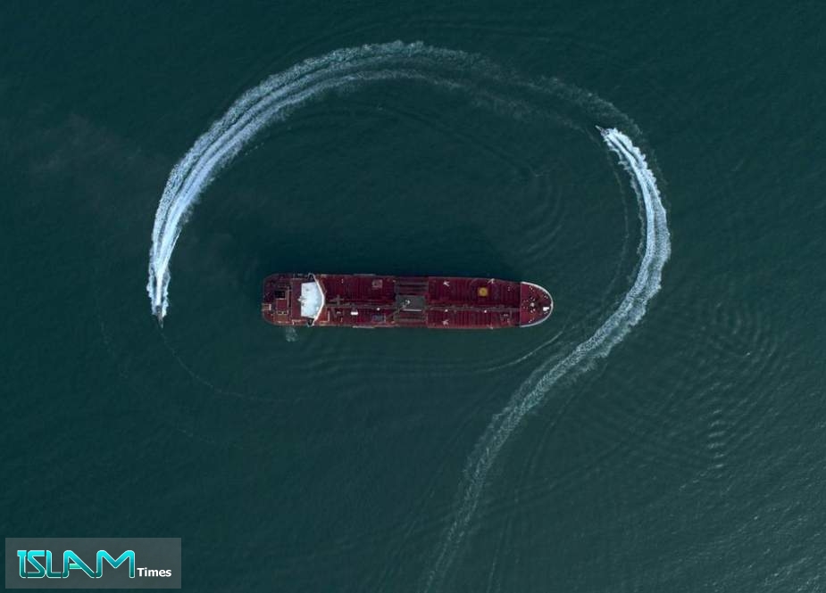 In this July 21, 2019 photo, an aerial view shows a speedboat of IRGC moving around the British-flagged oil tanker Stena Impero in the Iranian port of Bandar Abbas.